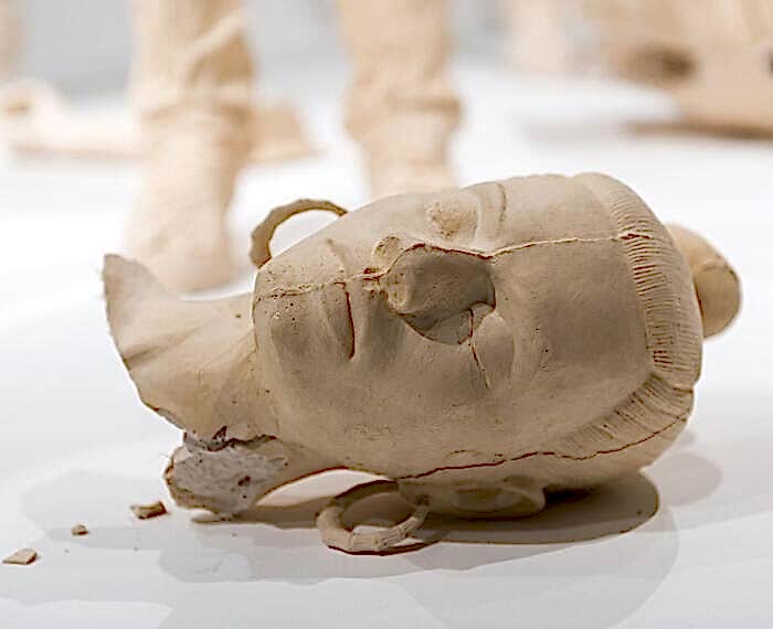 five terracotta-dyed, life-size, cast plaster female figures and video